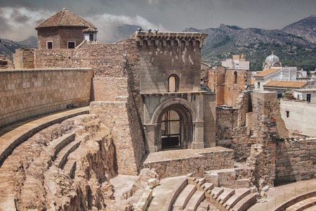 Roman theatre in Cartagena, Spain with mountains at the background. It has a museum and is open for touristsの写真素材