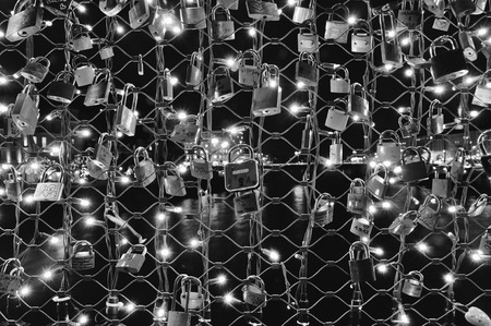 SALZBURG, AUSTRIA - DECEMBER 4, 2013: Famous Makartsteg pedestrian bridge with personal padlocks and lightsのeditorial素材