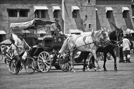 MARRAKESH, MOROCCO - AUGUST 21, 2011: View of the Djemaa El-Fna square. Horse carriage at the famous square in the Medinaのeditorial素材
