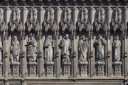 Details of Western facade of Westminster Abbey - Gothic church in London, UK. Seven Christian martyrs depicted in statues above the Great West Doorの写真素材