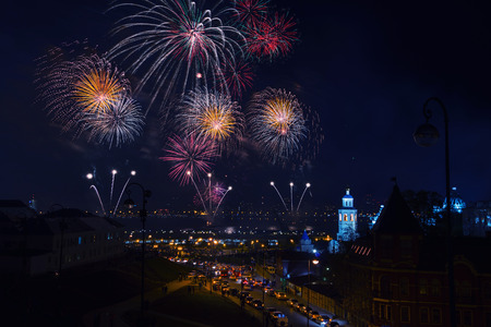 Firework in Kazan during the Victory Day - 9 May - in Russia. Night aerial view at the embankment area with road, cars and illuminated church and Kremlinの写真素材