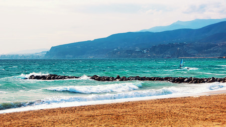 Kite surfing at Costa de Almeria, Spain. Windy weather at the beach with mountains at the background. Popular touristic destinationの写真素材