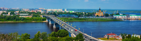 NIZHNY NOVGOROD, RUSSIA - JUNE 12, 2012: Aerial view at the modern part of the city with bridge over Oka river and various historical buildingsのeditorial素材