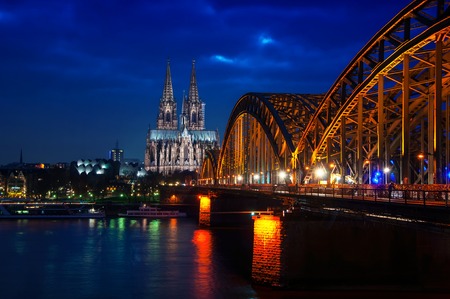 Cologne Cathedral, Germany, night view, with lights and illumination. Famous Hohenzollern Bridgeの写真素材