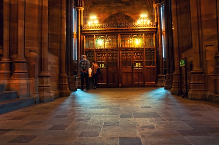 MANCHESTER, UK - SEPTEMBER 3, 2014: Inside a John Rylands Library - a late-Victorian neo-Gothic building and a famous landmark. Interior decoration with a bookshelfのeditorial素材