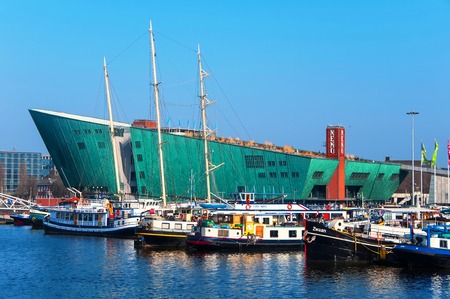 AMSTERDAM, NETHERLANDS - MARCH 12, 2014: Science center Nemo in the city harbor. Building designed by Renzo Piano since 1997のeditorial素材