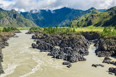 River Katun in Altai Republic, Russia. Panoramic view with Altai mountain range in East-Central Asia. The river is widely used for white water rafting, there are various touristic campsの写真素材