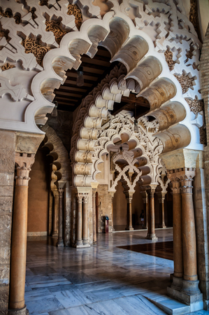 SARAGOSSA, SPAIN - JULY 12, 2013: Decorated arcs at the Aljaferia Palace - 11th century Arab castle is famous for its well preserved coffered ceilings.のeditorial素材