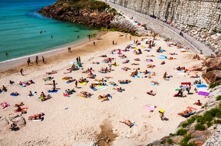 LA CORUNA, SPAIN - JULY 16, 2013: View of crowded beach at the midday in summer. This is one of the biggest cities in Galiciaのeditorial素材