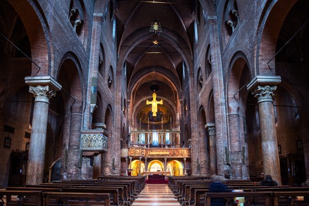 MODENA, ITALY - MARCH 8, 2016: Interiors of Cathedral - a Roman Catholic Romanesque church. Beautiful altar with wood crucifix from the 14th centuryのeditorial素材