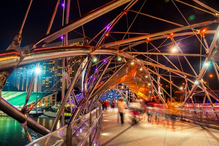 Night view of Helix pedestrian bridge in Marina Bay in Singapore. It is a part of the walkway around...