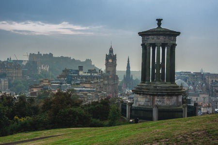 Calton Hill in Edinburgh, Scotland. Aerial view of the city with Castle and Clock Tower. Day, cloudy skyのeditorial素材