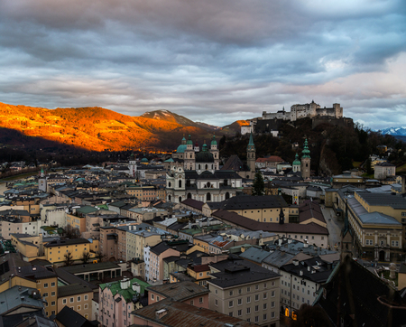Aerial view of Salzburg, Austria at sunset. Castle and Cathedral with mountain at the backgroundの写真素材