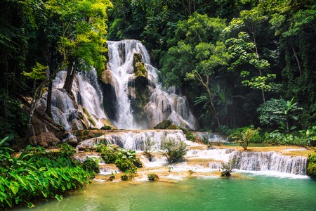 Kuang Si waterfall in Laos, Luang Prabang. Popular touristic destination during the sunny dayの写真素材