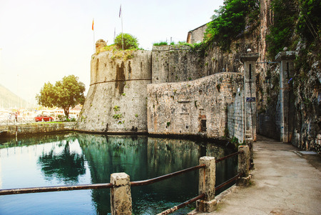 Entrance to the Old Town of Kotor, Montenegro during the day. Popular landmark with reflection in the waterの写真素材