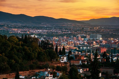 Granada, Spain. Aerial view of Granada - famous city in Andalusia, Spain at night with mountains at the background. It is a UNESCO World Heritage Site and a major touristic attractionの写真素材