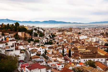 Granada, Spain. Aerial view of Granada - famous city in Andalusia, Spain in the morning with mountains at the background. It is a UNESCO World Heritage Site and a major touristic attractionの写真素材