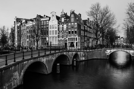 Amsterdam, Netherlands canals and bridges. Night view of Keizersgracht and famous touristic place. Black and whiteの写真素材