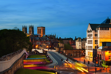 York, UK. Sundown of central York, UK, with York Minster cathedral on the back and blue cloudy sky.の写真素材