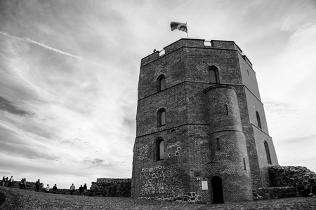 Vilnius, Lithuania. Gediminas tower in Vilnius, Lithuania with cloudy sky at the background. Black and whiteの写真素材