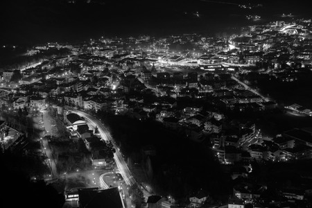 San Marino. Aerial view of San Marino at night. Illuminated houses and roads. Black and whiteの写真素材