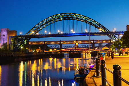 Newcastle upon Tyne, UK. The Tyne Bridge in Newcastle upon Tyne, UK, over river Tyne during night with the High Level Bridge behind itの写真素材