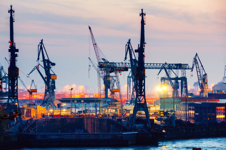 Port of Hamburg on the river Elbe in Germany in the nightの写真素材