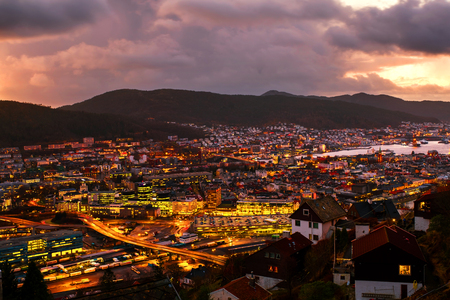 Aerial view of Bergen, Norway at night. Colorful cloudy sunset skyの写真素材