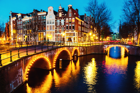 Night view of canals and bridges in Amsterdam, Netherlandsの写真素材
