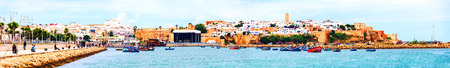 Fishing boats in Rabat, Morocco with old building at the backgroundの写真素材