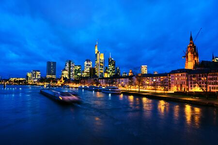 Skyline of Frankfurt, Germany in the sunset with famous illuminated skyscrapersの写真素材