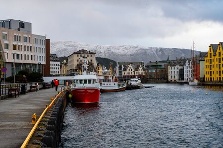View of center of Alesund, Norway during the winter. Cloudy skyの写真素材