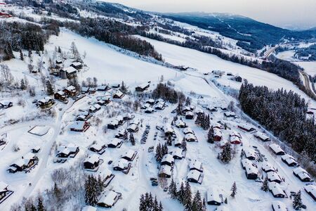 Aerial view of ski resort Hafjell in Norway with houses in winterの写真素材