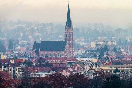 Graz, Austria. Aerial view of historical part of Graz, Austria. Landmarks with mountains at the backgroundの写真素材