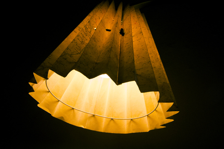 Orange and yellow map lamp on black background.の写真素材