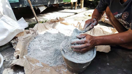 the process of mixing materials for plastering wallsの写真素材