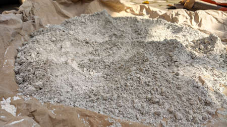 This is dry cement that is spread over the containerの写真素材