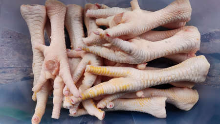 a pile of chicken feet that have been cleaned and ready to cookの写真素材