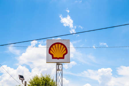 Conyers, Ga / USA - 07 27 20: Shell sky sign can be easily seen from interstate 20, power lines in viewのeditorial素材