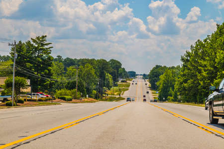 Snellville, Ga / USA - 07 20 20: Traffic on a stretch of highway with green landscape low center of the road viewのeditorial素材