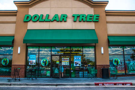 Loganville, Ga / USA - 07 20 20: View of the sign and entrance of a Dollar Tree retail store with a person opening the doorのeditorial素材