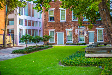 Augusta, Ga / USA - 07 10 20: Brick building and beautiful landscape background with green grass