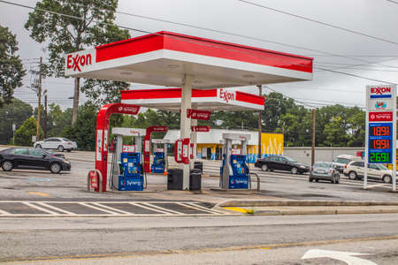 Decatur, Ga / USA - 07 07 20: Street view of Exxon gas pumps in an urban areaのeditorial素材