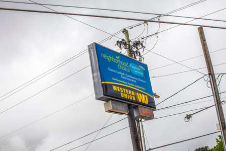 Decatur, Ga / USA - 07 07 20: View of urban landscape with sign, power pole and power linesのeditorial素材