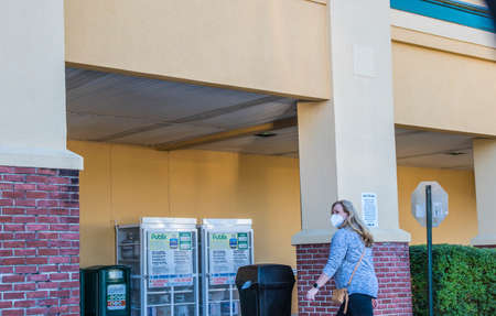 Augusta, Ga / USA - 11 20 20: Publix grocery store supermarket lady wearing a face mask walking in...