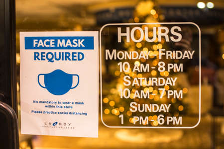 Augusta, Ga USA - 11 22 20: LaZBoy Furniture Gallery at night store hours and covid-19 signのeditorial素材