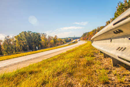 A long road in the country during the Fall in Georgiaの写真素材