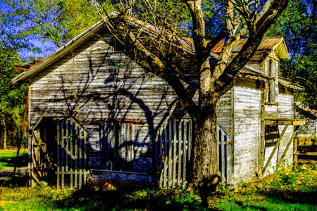 An old wooden rustic style barn in rural Georgia back corner view deep colorのeditorial素材