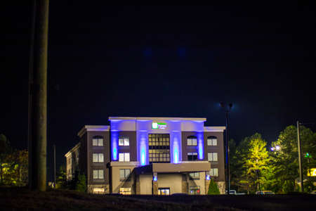 Augusta, Ga USA 11 23 20: Holiday Inn Express building distant view at nightのeditorial素材