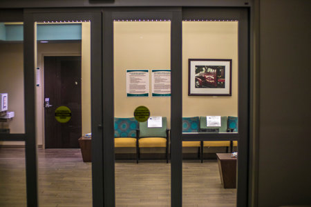 Augusta, Ga USA - 12 02 20: Social Distanced chairs at a prompt care hospital shot from outsideのeditorial素材